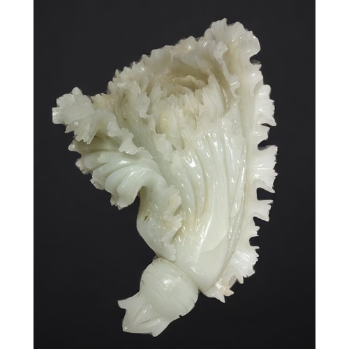 83 - A well-carved Chinese jade 'coloured 'soapstone sculpture of a flower, 30cm long