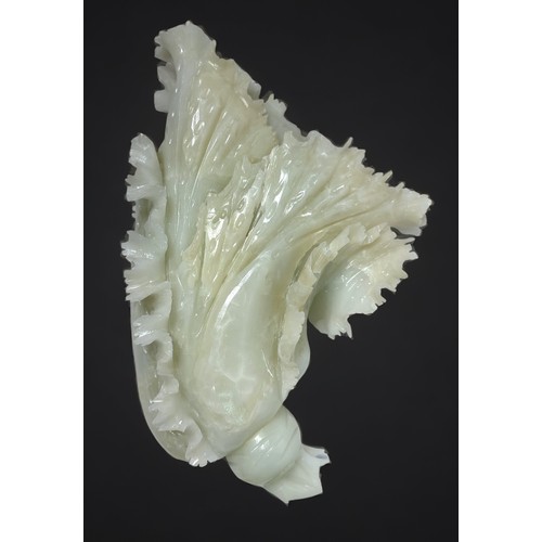 83 - A well-carved Chinese jade 'coloured 'soapstone sculpture of a flower, 30cm long