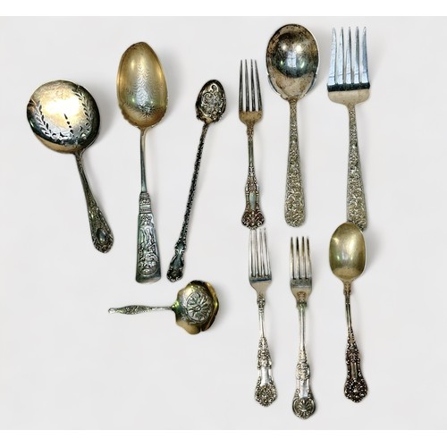 125 - A collection of assorted silver flatware including a Victorian fork by Chawner & Co. an ornately wor... 