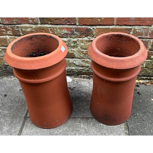 366 - Two various matching pairs of terracotta chimney pots, 63cm and 49cn high