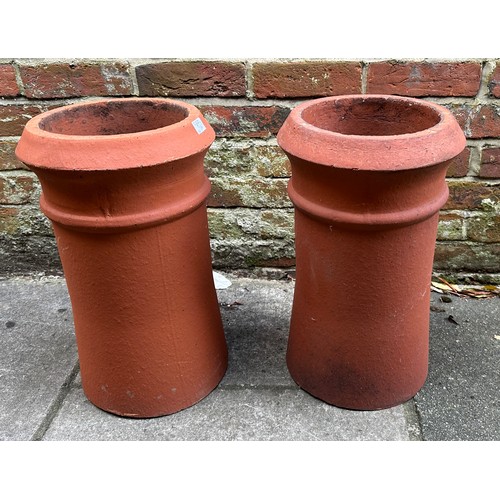 366 - Two various matching pairs of terracotta chimney pots, 63cm and 49cn high
