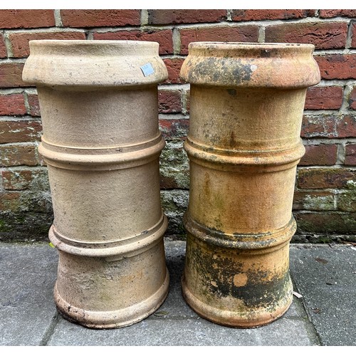 366 - Two various matching pairs of terracotta chimney pots, 63cm and 49cn high