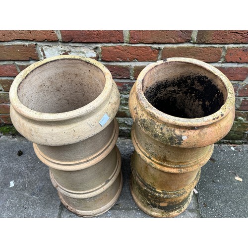 366 - Two various matching pairs of terracotta chimney pots, 63cm and 49cn high