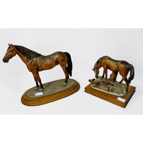 70 - Two various Capodimonte painted composite horse studies, on wooden plinth bases, 29cm and 19cm high,... 