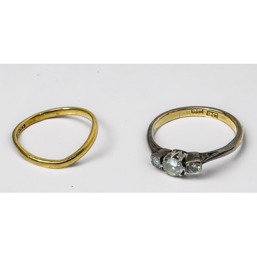 259 - An 18ct gold three-stone diamond ring, centre stone approximately 0.25cts flanked by two dimonds est... 