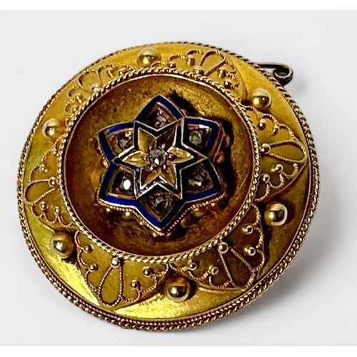 266 - A Victorian yellow metal, tests as 14ct gold or above, locket brooch, the central star shaped sectio... 