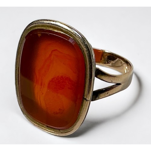 268 - A yellow metal, tests as 14ct gold or above ring, set with a large vacant seal carnelian, gross weig... 