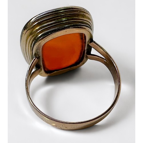 268 - A yellow metal, tests as 14ct gold or above ring, set with a large vacant seal carnelian, gross weig... 