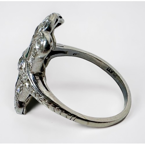 269 - An Art Deco period platinum ring, the shaped top centrally set with a marquise cut diamond surrounde... 