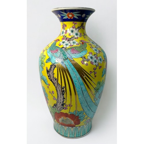 80 - A large Japanese porcerlain vase of baluster form, gilded and painted in polychrome enamels with exo... 