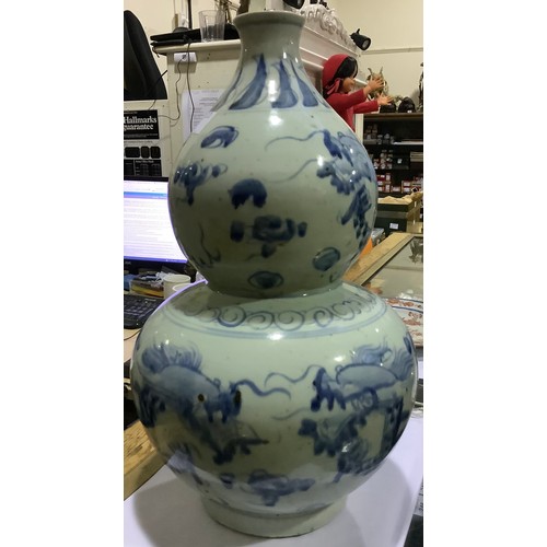 17 - A Chinese blue & white porcelain double-gourd vase, painted in the Ming 'style' with dragons persuin... 