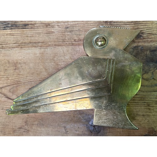 380 - An Art Deco brass vase modelled as a stylised bird, with removable pan to top, 20cm long