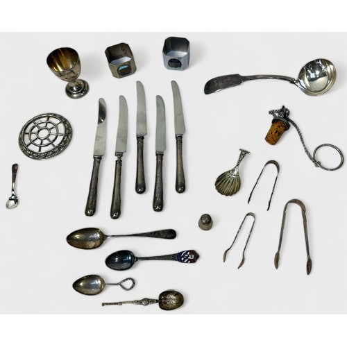 114 - A small collection of assorted silver, comprising, five silver-handled knives, sugar tongs, caddy sp... 