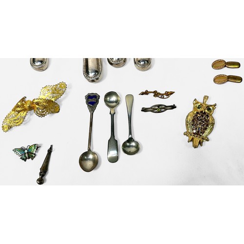 114 - A small collection of assorted silver, comprising, five silver-handled knives, sugar tongs, caddy sp... 