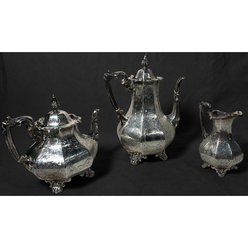 116 - A Victorian three-piece part tea and coffee set, of octagonal baluster form with foliate engraved de... 