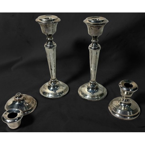 118 - A pair of silver candlesticks of inverted baluster form, with detachable drip pans, Birmingham, 1965... 