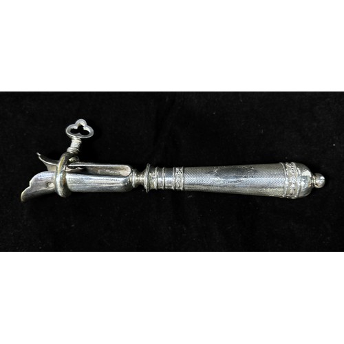121 - A French silver-handled 'Manche à gigot' (leg of lamb holder), with engine turned decoration and vac... 