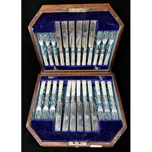 124 - A set of 12-each dessert knives and forks with engraved blades and mother-of-pearl handles in hinged... 