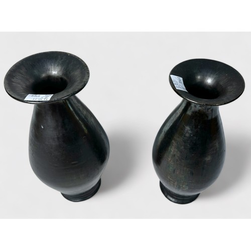 22 - A pair of glazed brown iridescent vases, of tapering ovoid form, with wide flanged neck, metallic fi... 