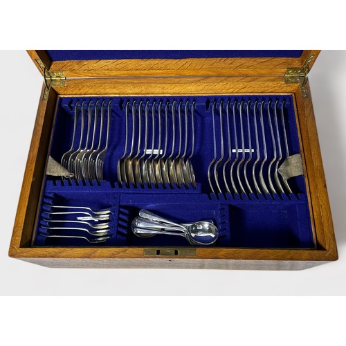 125 - A mid 20th century oak three-tier canteen of cutlery comprising Roberts & Belk Old English pattern s... 