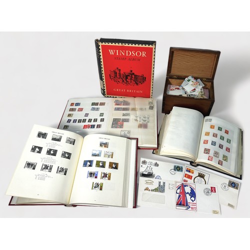 332 - A collection of GB and World stamps, mounted and unmounted, across three albums and a small box cont... 