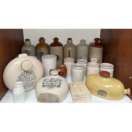 24 - A collection of stoneware hot water bottles and  bed warmers, including a Doulton & Lambeth example ... 