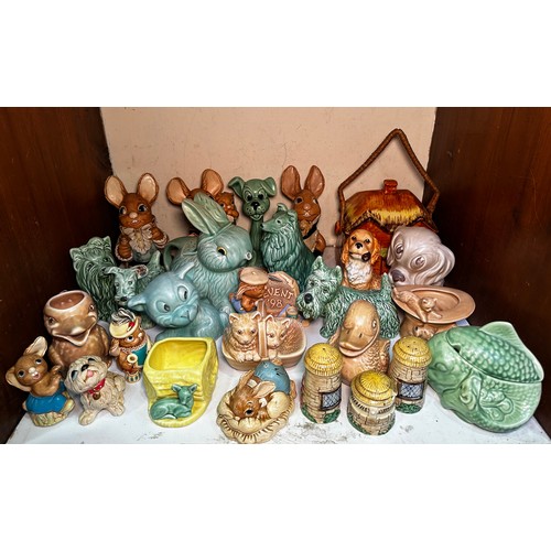 25 - A quantity of assorted Sylvac and Pendelfin rabbit and dog figures in various colours, including, a ... 