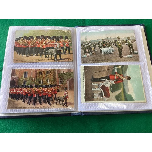 324 - A collection of approximately 520 standard-size military postcards in three albums, including art, c... 