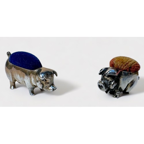 356 - Two various sterling silver pin cushions modelled as pigs, the smaller example with rubbed Birmigham... 