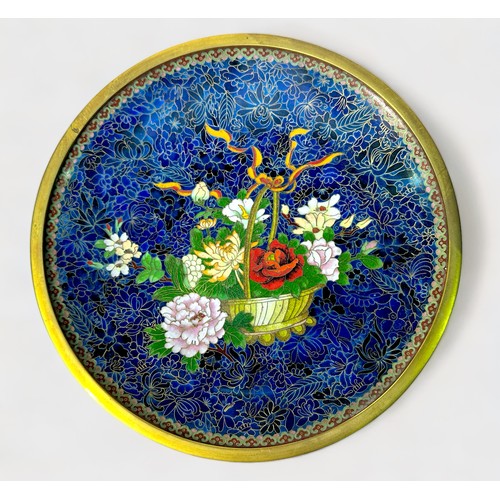 84 - A Chinese cloisonné enamel comport or dish, decorated with polychrome flowers in a basket to dark bl... 