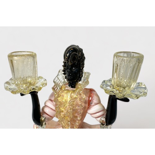 39 - A garniture of Murano Glass Blackamoor figural candlesticks, pink, white and black glass with gold i... 