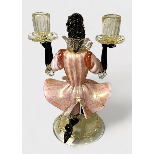 39 - A garniture of Murano Glass Blackamoor figural candlesticks, pink, white and black glass with gold i... 