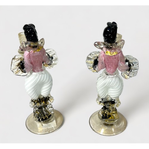 39 - A garniture of Murano Glass Blackamoor figural candlesticks, pink, white and black glass with gold i... 