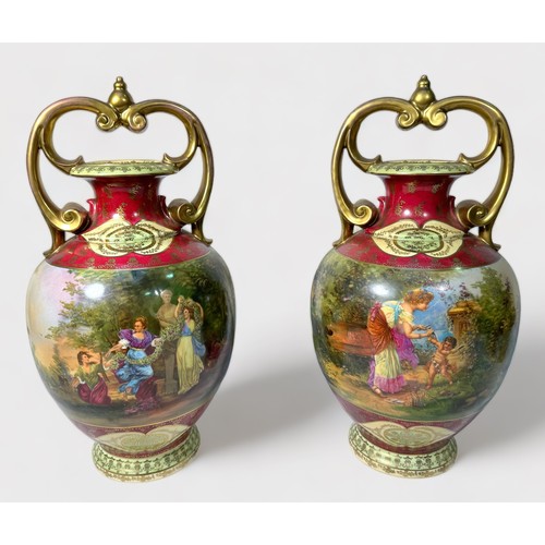 35 - A pair of Vienna style Porcelain vases of ovoid baluster form with scrolled gilt-handles, gilt-decor... 