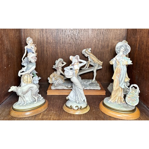 46 - Four various Capodimonte figure groups, including, boy and girl on a seesaw, signed by Giuseppe Arma... 