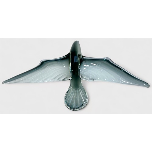 50 - A Murano style glass sculpture of a seagull in flight, raised on naturalistic glass base modelled as... 