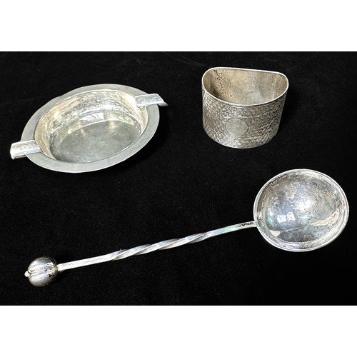 137 - A pair of silver bottle coasters with turned wooden bases, together with an Arts & Crafts spoon with... 