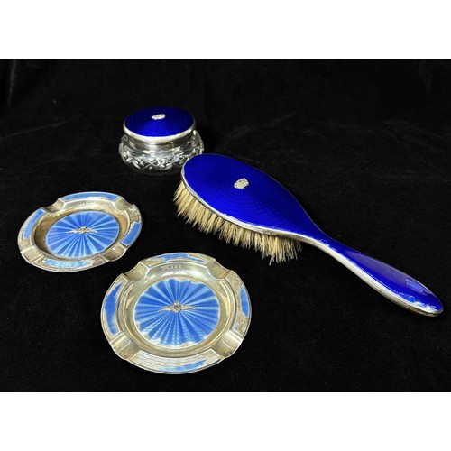 136 - A silver and blue guilloche enamel handbrush and matching topped cut-glass toilette jar both mounted... 