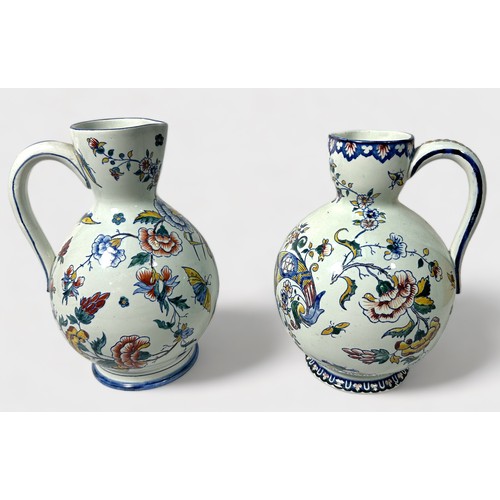 53 - Two 19th century French faience jugs, each with polychrome floral decoration, underglaze blue 'Castl... 