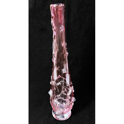 56 - A cranberry glass vase, of inverted baluster form, with relief moulded floral decoration, with etche... 