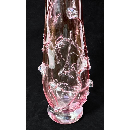 56 - A cranberry glass vase, of inverted baluster form, with relief moulded floral decoration, with etche... 