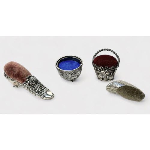 372 - Four various novelty pin cushions including a silver example modelled as a shoe, makers marks ‘AF’, ... 