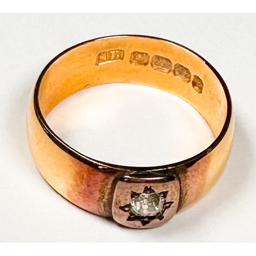 231 - A 22ct gold wedding ring, star-set to the centre with a Victorian cut diamond, estimated diamond wei... 