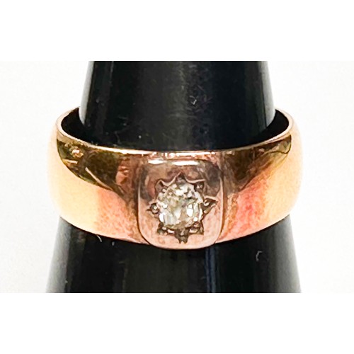 231 - A 22ct gold wedding ring, star-set to the centre with a Victorian cut diamond, estimated diamond wei... 