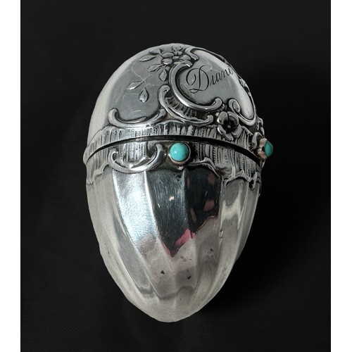 389 - A 19th century continental silver egg-shaped Etui, probably German, one half with sprial-fluted pane... 