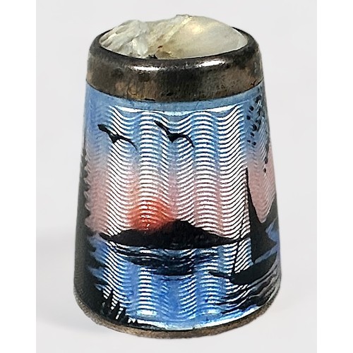 388 - A Norwegian Enamelled thimble by David Anderson, the body with a landscape/seascape at dusk with tre... 