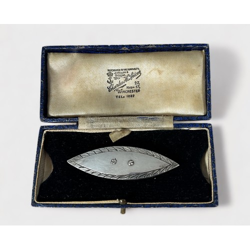 390 - An early 19th century unmarked silver tatting shuttle, typical two-piece ellipticle form, one side h... 