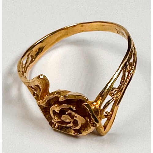 232 - A 22ct yellow gold dress ring, in a rose-petal design with pierced foliate band, weight 2.5 grams, s... 