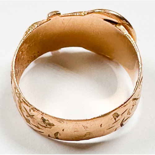 224 - An 18ct yellow gold buckle ring with foliate engraving, ring weighs 8.6 grams, hallmarked 1910.