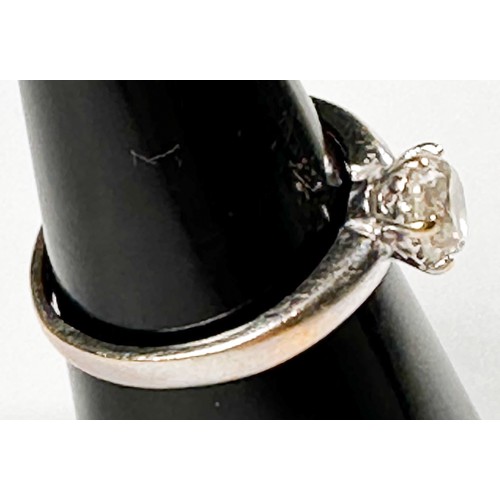 255 - An 18ct white gold solitaire diamond ring, six claw set with a round diamond, estimated K colour, P3... 